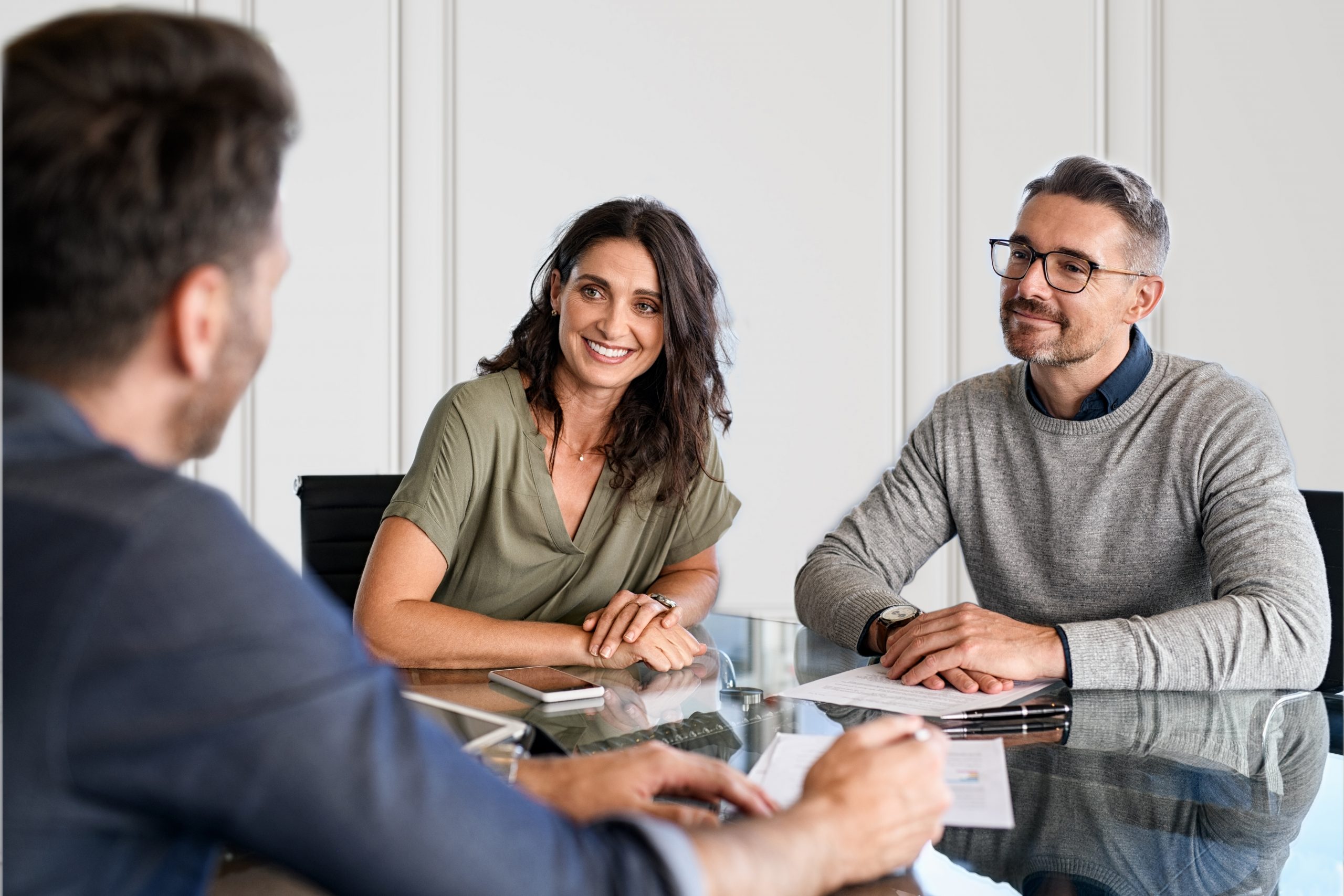 Mature couple meeting financial advisor for investment